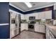 Kitchen with stainless steel appliances and modern white cabinets at 4294 Rivergate Ln., Little River, SC 29566