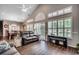 Bright living room with hardwood floors, modern decor, and lots of natural light at 4294 Rivergate Ln., Little River, SC 29566