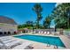 Inviting community pool with plenty of lounge chairs, tables, and umbrellas for relaxation at 4294 Rivergate Ln., Little River, SC 29566