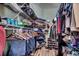Organized walk-in closet with ample shelving and hanging space for clothes and storage at 4294 Rivergate Ln., Little River, SC 29566