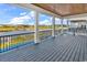 Enjoy views from this covered back porch with wood ceiling and black metal railings, overlooking the river and neighborhood at 437 Saint Julian Ln., Myrtle Beach, SC 29579