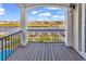 Relaxing back porch area with white columns and railings and views of the river and surrounding homes at 437 Saint Julian Ln., Myrtle Beach, SC 29579