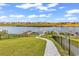 Lush backyard featuring a stone pathway leading to private docks and waterfront access, ideal for outdoor enjoyment at 437 Saint Julian Ln., Myrtle Beach, SC 29579
