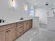 Modern bathroom featuring a double sink vanity, quartz countertops, and a luxurious stand up shower at 437 Saint Julian Ln., Myrtle Beach, SC 29579