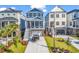 Charming coastal-style home with a two-story design, a covered porch, and a well-manicured front yard at 437 Saint Julian Ln., Myrtle Beach, SC 29579