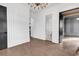 Bright hallway with paneled walls and trim, hardwood floors, and access to a bathroom at 437 Saint Julian Ln., Myrtle Beach, SC 29579