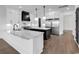 Modern kitchen featuring a large island, stainless steel appliances, and white marble countertops at 437 Saint Julian Ln., Myrtle Beach, SC 29579