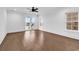 A living room featuring hardwood floors, large windows, and access to the pool area at 437 Saint Julian Ln., Myrtle Beach, SC 29579