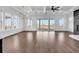 Expansive living room with coffered ceilings, fireplace, and sliding doors to an outdoor balcony at 437 Saint Julian Ln., Myrtle Beach, SC 29579