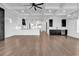 Open concept kitchen and living area with coffered ceiling, large windows and luxury features at 437 Saint Julian Ln., Myrtle Beach, SC 29579