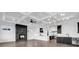 Open concept living area with fireplace, coffered ceilings, and view into kitchen and bar area at 437 Saint Julian Ln., Myrtle Beach, SC 29579