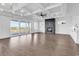 Spacious living area featuring a fireplace, coffered ceilings, and access to an outdoor balcony at 437 Saint Julian Ln., Myrtle Beach, SC 29579