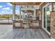 An outdoor kitchen on the patio features a stainless steel grill, ideal for outdoor cooking and entertaining guests at 437 Saint Julian Ln., Myrtle Beach, SC 29579