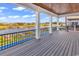 A porch featuring a wood ceiling overlooks a pool and water views at 437 Saint Julian Ln., Myrtle Beach, SC 29579