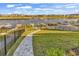 Expansive backyard with a stone pathway leading to a waterfront dock at 441 Saint Julian Ln., Myrtle Beach, SC 29579