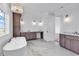 Light and bright bathroom with marble floors, a soaking tub, and stylish double vanities at 441 Saint Julian Ln., Myrtle Beach, SC 29579