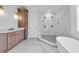 Bathroom featuring double vanities, marble floors, a stand alone shower, and a separate water closet at 441 Saint Julian Ln., Myrtle Beach, SC 29579