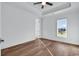 A well-lit bedroom features tray ceiling, beautiful hardwood floors and a large window at 441 Saint Julian Ln., Myrtle Beach, SC 29579
