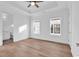 A well-lit bedroom features tray ceiling, beautiful hardwood floors and a view from two windows at 441 Saint Julian Ln., Myrtle Beach, SC 29579