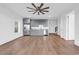Bright kitchen features stainless steel appliances, gray cabinets and beautiful hardwood floors at 441 Saint Julian Ln., Myrtle Beach, SC 29579