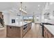Spacious kitchen featuring a large island with a sink, a range, and stainless steel appliances at 441 Saint Julian Ln., Myrtle Beach, SC 29579