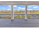 Covered porch with columns offering picturesque views of the lake at 441 Saint Julian Ln., Myrtle Beach, SC 29579