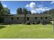 A brick house is situated in a spacious yard with a well-maintained lawn at 444 Davis Rd., Hemingway, SC 29554