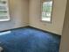 A bedroom featuring a wall-to-wall carpet and two windows providing natural light at 444 Davis Rd., Hemingway, SC 29554