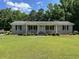 Charming brick home featuring a well-manicured front yard and a inviting entryway at 444 Davis Rd., Hemingway, SC 29554