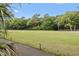 Expansive green backyard with lush trees, offering a serene and private outdoor space at 4803 Bucks Bluff Dr., North Myrtle Beach, SC 29582
