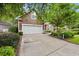 Charming two-story home featuring a well-maintained lawn, a two-car garage, and beautiful landscaping at 4803 Bucks Bluff Dr., North Myrtle Beach, SC 29582