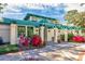 Exterior view of the fitness center featuring colorful landscaping and a welcoming entrance at 4803 Bucks Bluff Dr., North Myrtle Beach, SC 29582