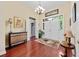 Inviting foyer with hardwood floors, a chandelier, and a decorative console table at 4803 Bucks Bluff Dr., North Myrtle Beach, SC 29582