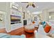 Bright living area with hardwood floors, a fireplace, and custom built-in shelving at 4803 Bucks Bluff Dr., North Myrtle Beach, SC 29582