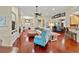 Spacious living room with hardwood floors, fireplace, and seamless flow to dining and kitchen areas at 4803 Bucks Bluff Dr., North Myrtle Beach, SC 29582