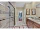 The main bathroom features a glass shower, double vanity, walk-in closet, and tile flooring at 4803 Bucks Bluff Dr., North Myrtle Beach, SC 29582