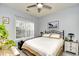 Comfortable bedroom with a ceiling fan, large window for natural light, and neutral color palette for rest at 4811 Innisbrook Ct. # 306, Myrtle Beach, SC 29579