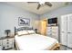 Inviting bedroom with ceiling fan, ensuite bathroom, and a spacious closet for maximum storage and comfort at 4811 Innisbrook Ct. # 306, Myrtle Beach, SC 29579