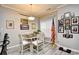 Dining area with a wooden table set, framed pictures and an American flag at 4811 Innisbrook Ct. # 306, Myrtle Beach, SC 29579