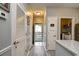 Hallway with multiple doors, closet, and granite countertop at 4811 Innisbrook Ct. # 306, Myrtle Beach, SC 29579