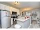Cozy kitchen with stainless steel appliances, white cabinets, and gray countertops at 4811 Innisbrook Ct. # 306, Myrtle Beach, SC 29579