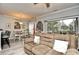 Open-concept living area features a comfortable sofa and dining area with outdoor views at 4811 Innisbrook Ct. # 306, Myrtle Beach, SC 29579