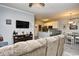 Comfortable living room showing TV, kitchen, and dining area, perfect for Gathering time at 4811 Innisbrook Ct. # 306, Myrtle Beach, SC 29579