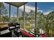 Relaxing screened porch with comfortable seating and a beautiful view of lush greenery at 4811 Innisbrook Ct. # 306, Myrtle Beach, SC 29579