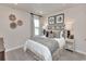 Bedroom with decoratively appointed bed and matching bedside tables and art at 4861 Hopespring St., Myrtle Beach, SC 29579