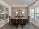 Elegant dining room with stylish decor, featuring a large dining table with seating for six and modern art at 4861 Hopespring St., Myrtle Beach, SC 29579