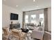 Bright and airy living room featuring stylish furniture, hardwood floors, and large windows offering plenty of natural light at 4861 Hopespring St., Myrtle Beach, SC 29579