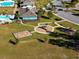 Aerial view of a playground, park and clubhouse with pool in a residential community at 4861 Hopespring St., Myrtle Beach, SC 29579