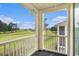 A peaceful screened balcony overlooking a well-maintained golf course and blue skies at 488 River Oaks Dr. # 61N, Myrtle Beach, SC 29579