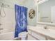 Bathroom showcasing a shower-tub combo with a decorative shower curtain and sink at 488 River Oaks Dr. # 61N, Myrtle Beach, SC 29579